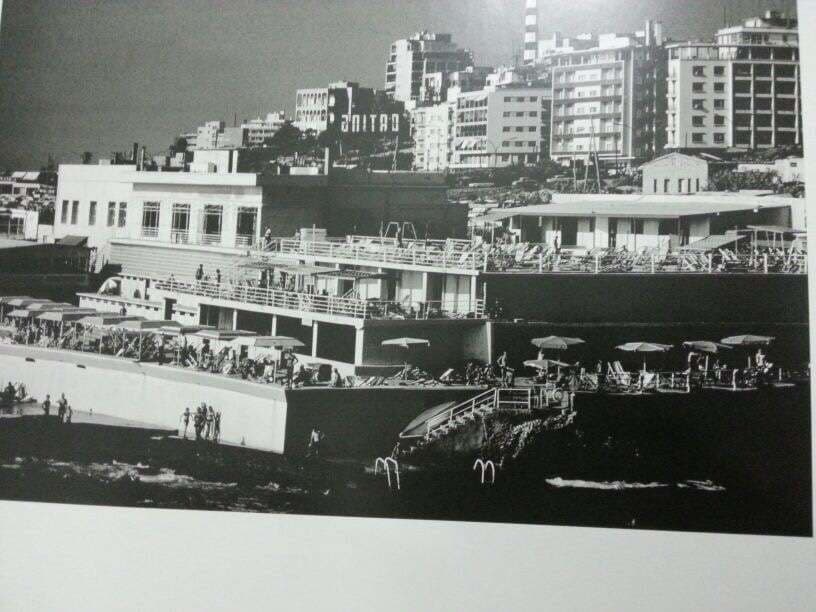A panorama of Sporting Club Beach with the Sporting sign on the hill — an archive photograph