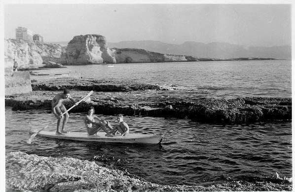 Canoeing off the rocks at Sporting Club Beach — an archive photograph