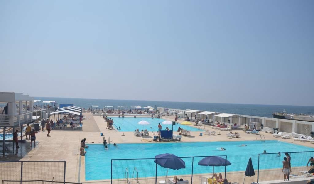 The saltwater pools and shaded cabanas on the deck above the sea at Sporting Club Beach, Ras Beirut