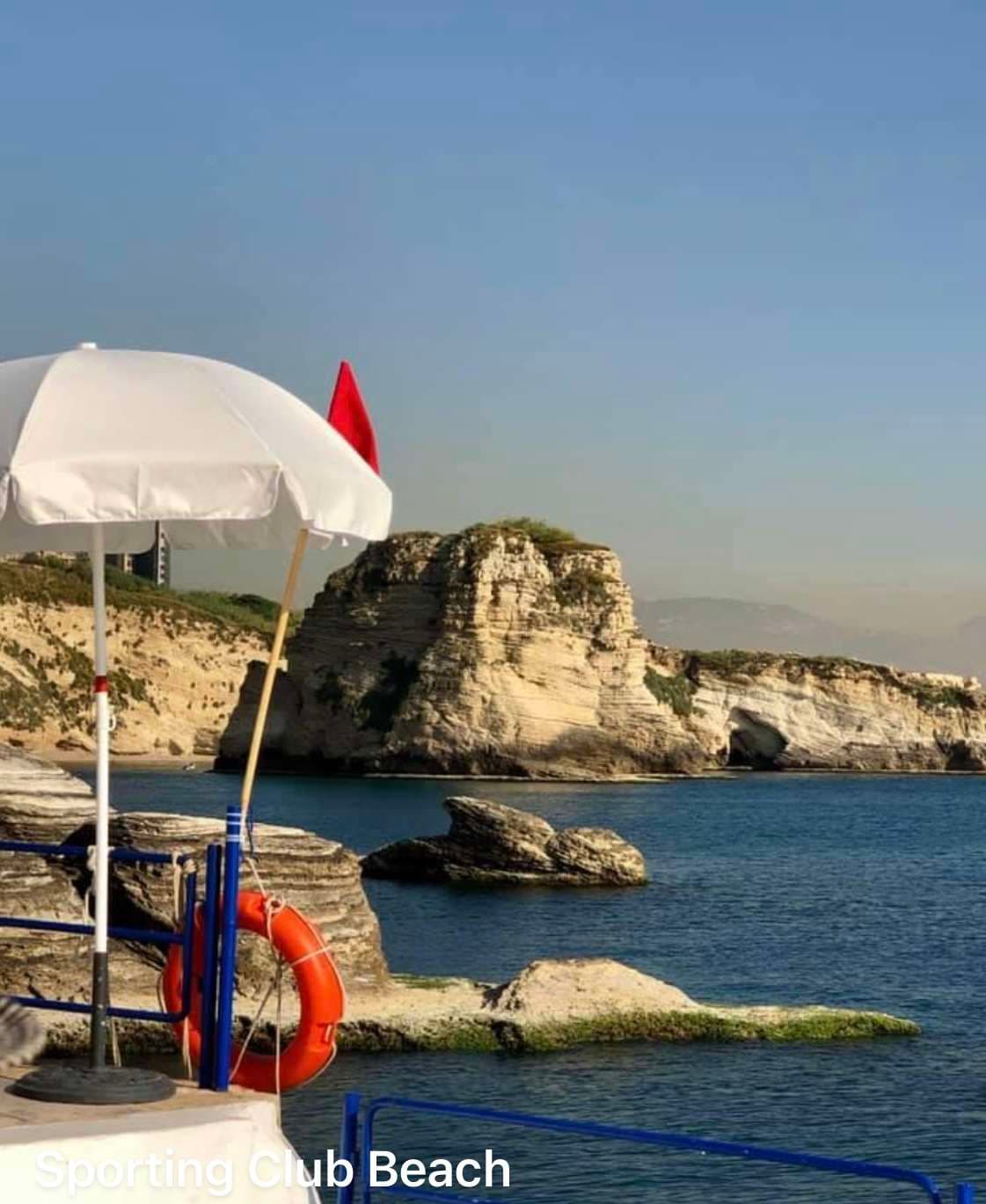 A view from the bathing terraces toward the Pigeon Rocks across the open sea at Sporting Club Beach, Ras Beirut