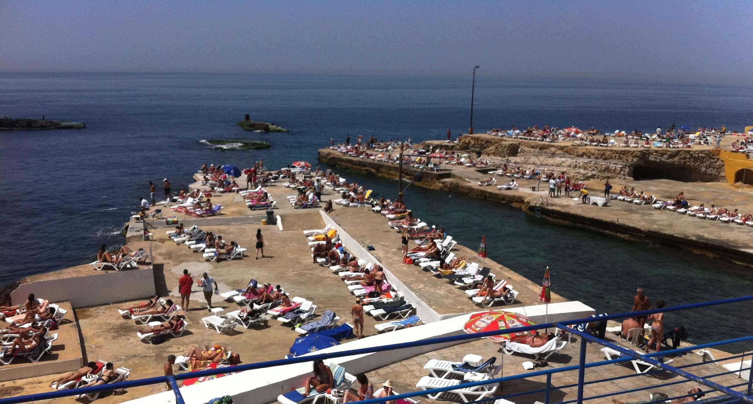 The pools, decks, and umbrellas along the shoreline at Sporting Club Beach