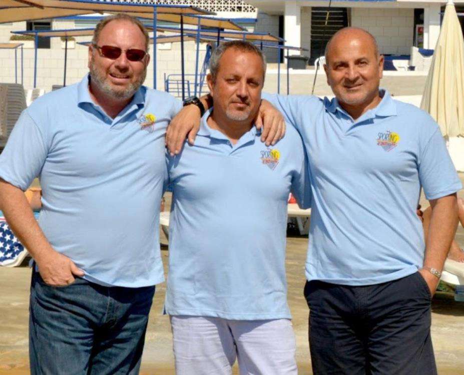 Three members of the team on the pool deck at Sporting Club Beach