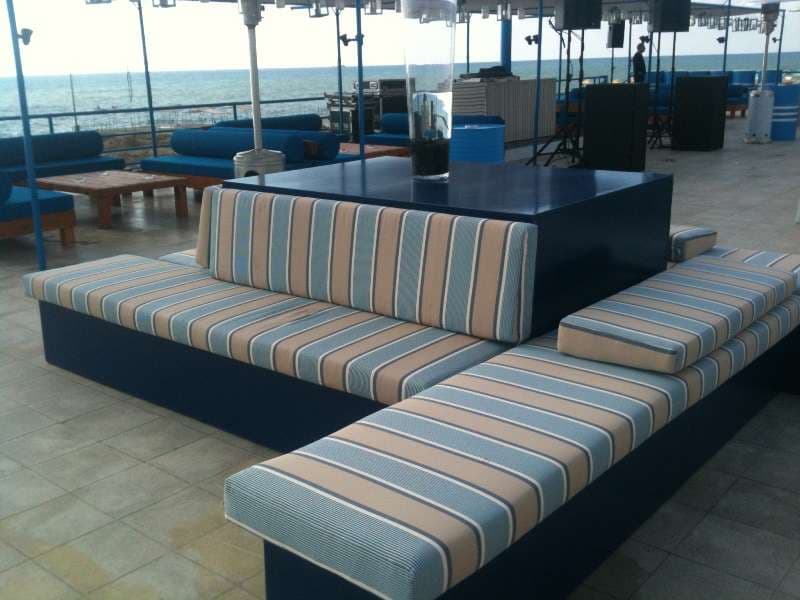 Striped sea-view lounge seating on the event terrace at Sporting Club Beach, Ras Beirut