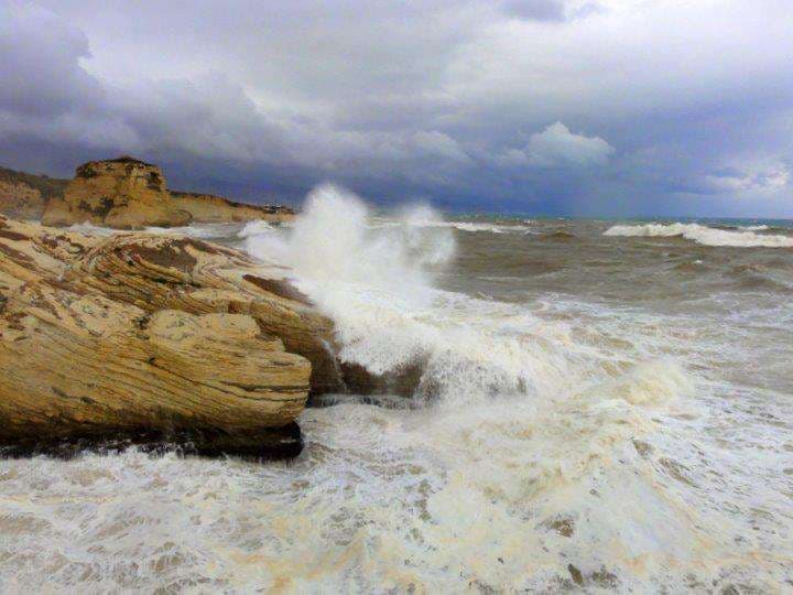 Rough seas crashing over the rocky coastline at Sporting Club Beach, Ras Beirut
