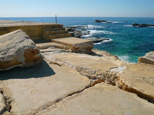 Stone steps leading down to the rocky shore and open sea at Sporting Club Beach, Ras Beirut