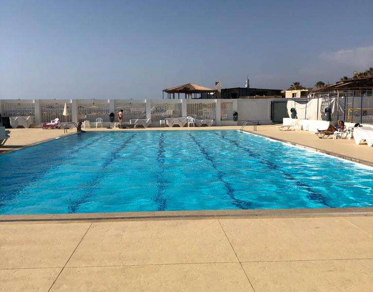 A saltwater swimming pool and sun deck at Sporting Club Beach