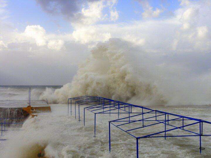 A winter storm sending waves over the shore structures at Sporting Club Beach, Ras Beirut
