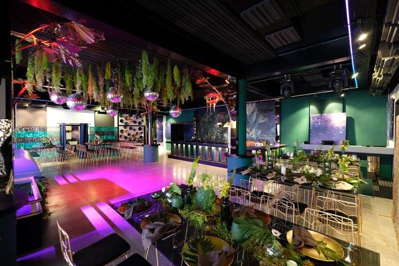 The Loft with dancefloor, disco balls and event tables at Sporting Club Beach