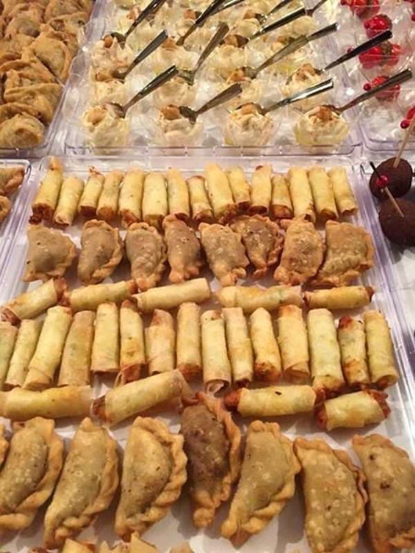 Trays of assorted fried finger foods at Sporting Club Beach