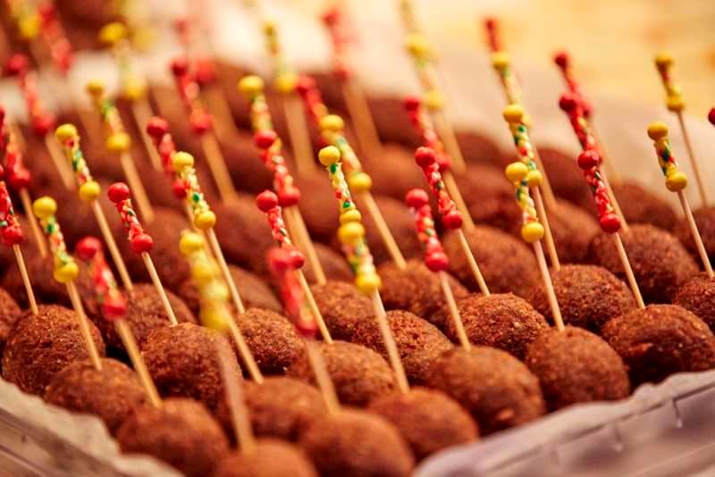 Fried kibbeh balls on garnished cocktail picks at Sporting Club Beach
