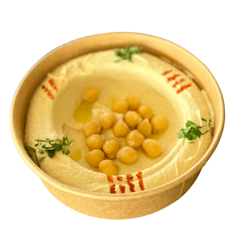 A bowl of hummus topped with chickpeas at Sporting Club Beach