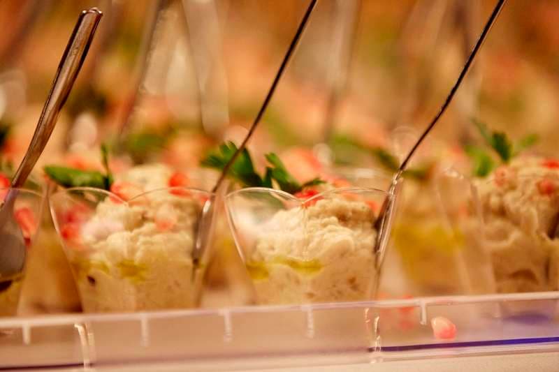 Tabbouleh served in individual clear cups at Sporting Club Beach