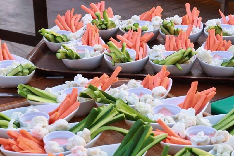 Cut crudités in paper cones on buffet trays at Sporting Club Beach