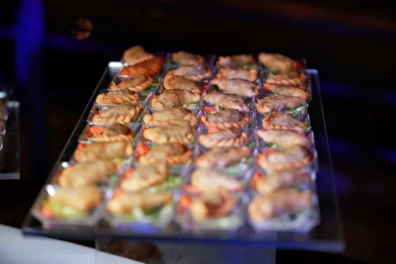 Fried pastries served in individual trays at Sporting Club Beach