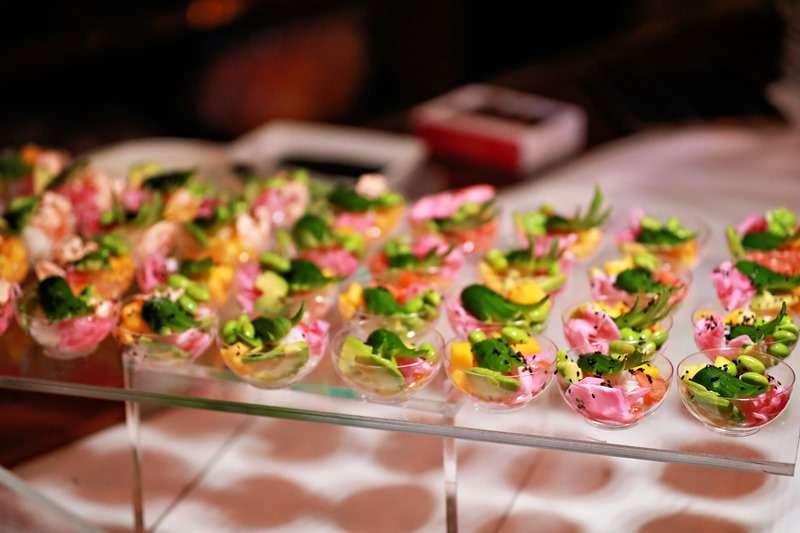 Fried spring rolls in individual serving trays at Sporting Club Beach