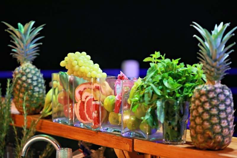 A bar fruit and herb display set up for drinks service at Sporting Club Beach