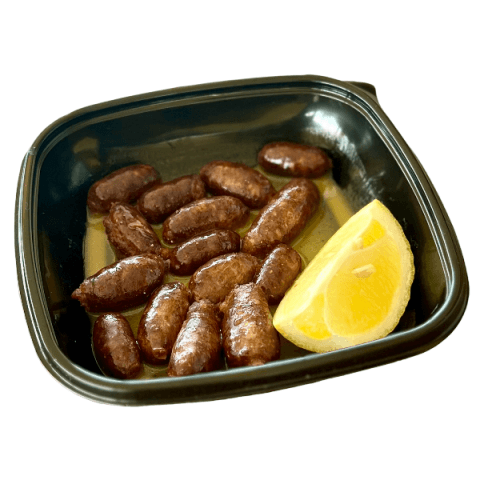 Makanek sausages with lemon at Sporting Club Beach