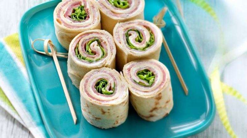 Wrap rolls served on a plate at Sporting Club Beach