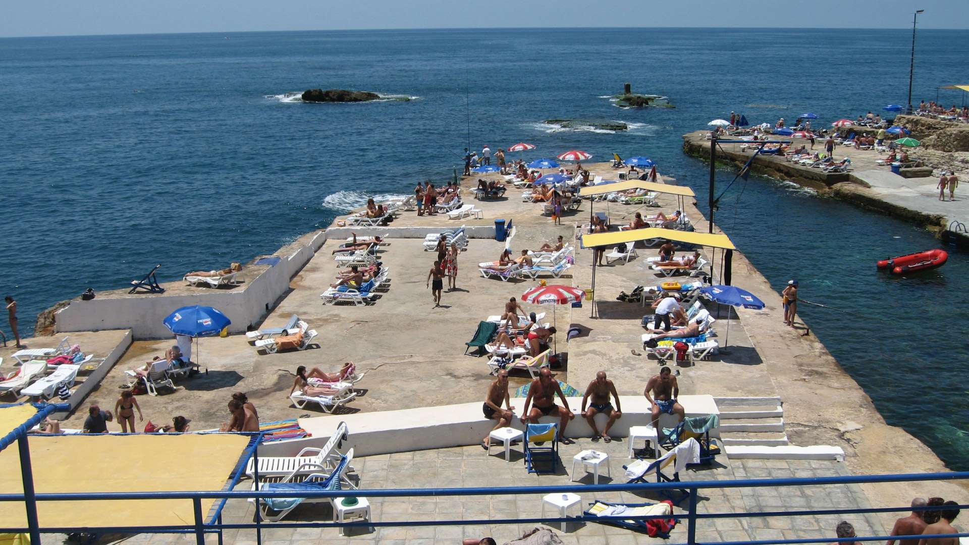 Aerial view of the saltwater pools, decks, and shoreline at Sporting Club Beach in Ras Beirut