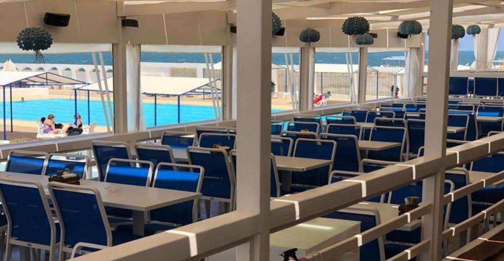 Lunch on the terrace at The Deck Cafe Restaurant, Sporting Club Beach