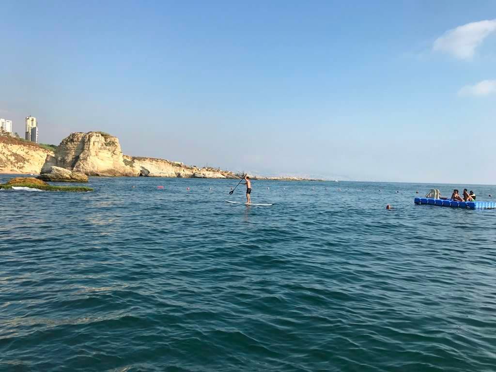 Members swimming in the Mediterranean off Sporting Club Beach