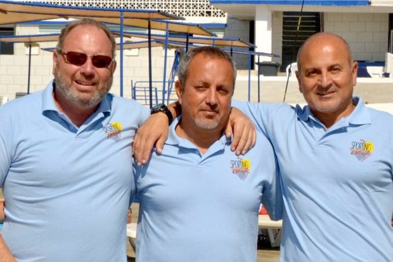 Walid, Marwan, and Ralph Abou Nassar at Sporting Club Beach — three brothers, second generation, in matching club polos on the pool deck